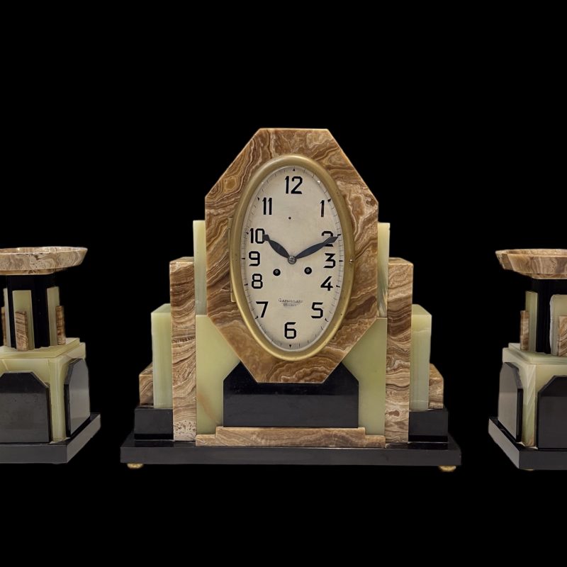 A French Art Deco Clock with it’s Pair of Matching Garnitures