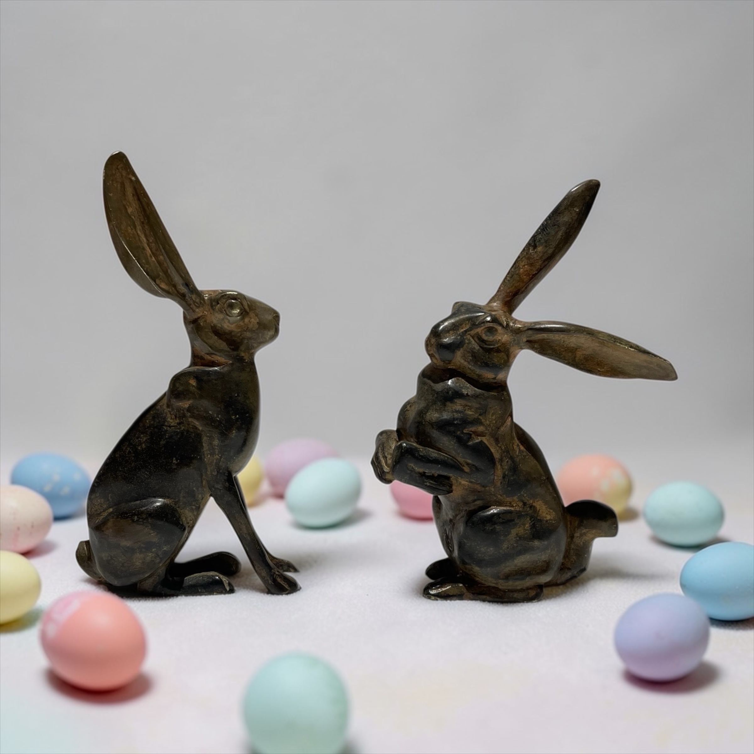 A Pair of Stylised Bronze Hares