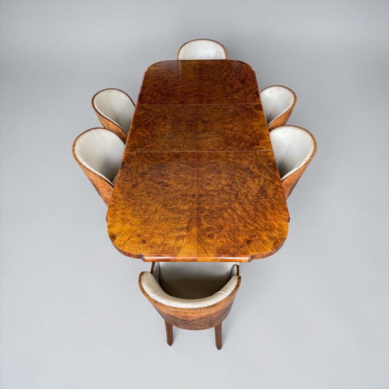 A Superb Dining Table and Six Chairs by Maurice Adams